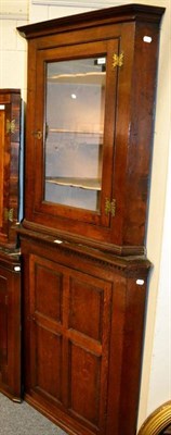 Lot 1389 - Late George III oak and glazed hanging corner cupboard; and a George III oak corner cupboard...