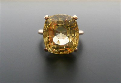 Lot 274 - A Yellow Sapphire Solitaire Ring, estimated weight 9.50 carat approximately, finger size J.