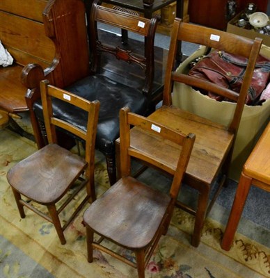 Lot 1410 - A pair of child's oak chairs; a Regency leather dining chair; and one other dining chair (4)