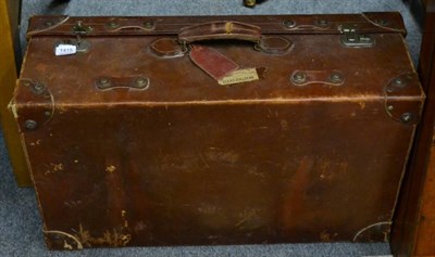 Lot 1415 - A large leather suitcase