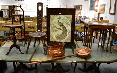 Lot 1417 - A Welsh carved oak spinning chair; a nest of tables; a copper coal helmet; a folding cake stand; an