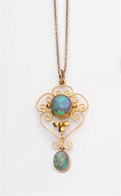 Lot 275 - An Art Nouveau Black Opal Pendant, the scroll design centred by a round cabochon black opal,...