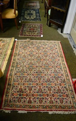 Lot 1438 - Indian rug, the lozenge field of stylised plants framed by mushroom borders, 127cm by 80cm;...