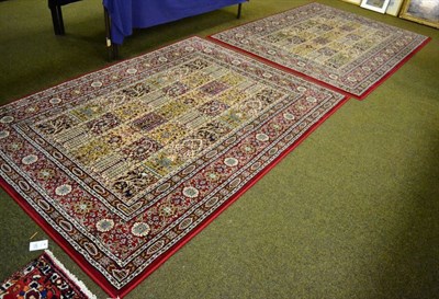 Lot 1440 - Pair of machine made rugs of compartmentalised Persian garden design, each approximately 230cm...