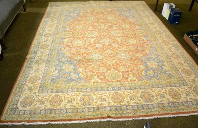 Lot 1442 - An Indo Tabriz carpet (modern) the terracotta field of vines and large palmettes enclosed by...