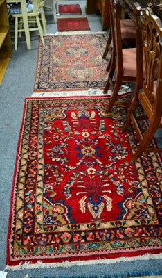 Lot 1453 - Indian rug the terracotta field with urns issuing flowers enclosed by floral borders, 154cm by...