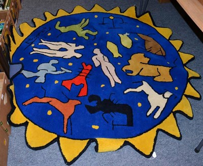 Lot 1455 - A modern shaped circular wool rug, woven with signs of the zodiac and bearing signature