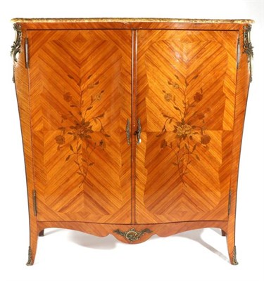 Lot 1472 - A Louis XV style tulipwood, bois satine and marquetry inlaid serpentine shaped cupboard, circa...