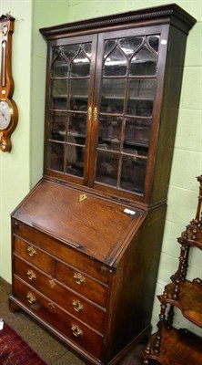 Lot 1474 - An 18th century Gothic influence oak bureau bookcase