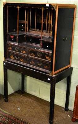 Lot 1482 - A Chinese lacquer cabinet on stand