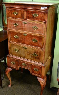 Lot 1484 - An early 20th century walnut chest on stand with cabriole legs and shell carved knees