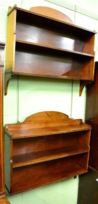 Lot 1492 - A pair of mahogany wall shelves, with reeded decoration