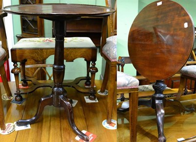 Lot 1502 - George III oak tripod table with associated mahogany circular top; and a George III mahogany tripod