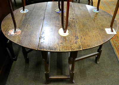 Lot 1503 - An 18th century oak gateleg dining table