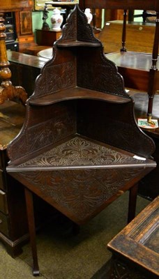 Lot 1506 - Early 20th century carved walnut corner stand with drop leaf