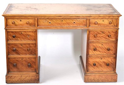 Lot 1516 - A Victorian satinwood double pedestal desk, circa 1870, with three frieze drawers, one pedestal...