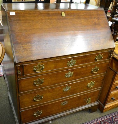 Lot 1519 - George III oak bureau, with fall front on bracket feet