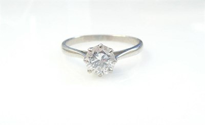 Lot 284 - A Diamond Solitaire Ring, the round brilliant cut diamond in a white eight claw setting to a...