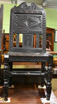 Lot 1524 - An 18th century oak side chair later carved