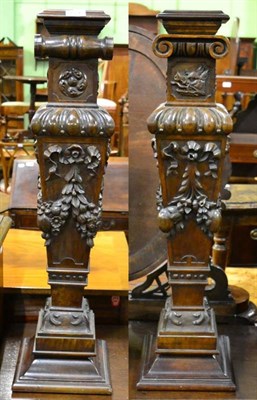 Lot 1526 - A pair of late Victorian/Edwardian carved walnut newel posts, crested with a boar's head