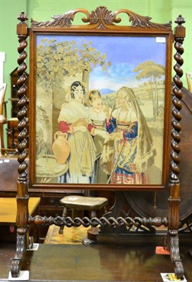 Lot 1527 - A Victorian rosewood framed needle work firescreen with boldly turned uprights and a twin...