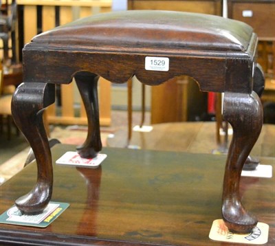 Lot 1529 - A Georgian style leather upholstered square oak stool, on cabriole supportsÂ