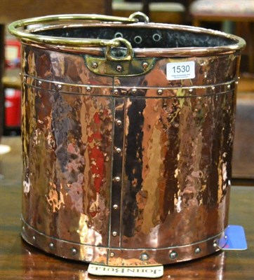 Lot 1530 - A copper beaten log bucket