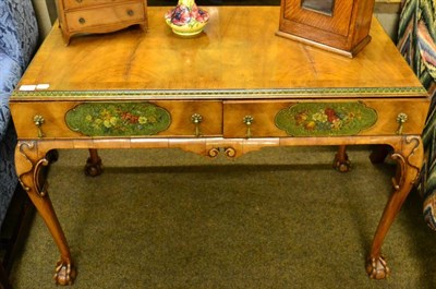 Lot 1539 - A 1920s figured walnut two drawer serving table