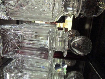 Lot 1542 - A mahogany table top cocktail cabinet containing four decanters, six whisky tumblers and six sherry