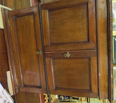 Lot 1542 - A mahogany table top cocktail cabinet containing four decanters, six whisky tumblers and six sherry