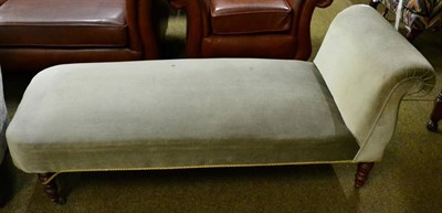 Lot 1545 - Late Victorian green upholstered chaise longue