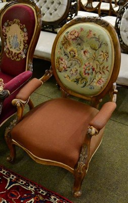 Lot 1555 - Victorian walnut framed open armchair with needlework padded back support