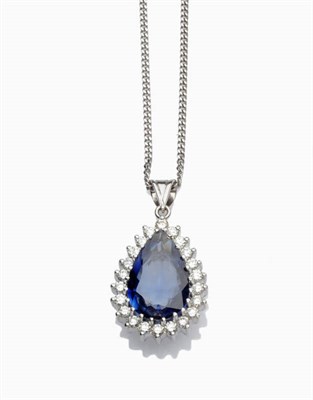 Lot 288 - A Sapphire and Diamond Pendant on an 18 Carat White Gold Chain, a pear cut sapphire claw set within