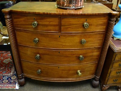 Lot 1570 - A 19th century mahogany four height bow fronted chest of drawers, with spirally fluted pillars