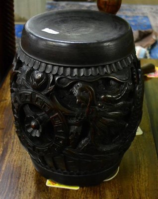 Lot 1580 - A Chinese carved hardwood barrel form stool