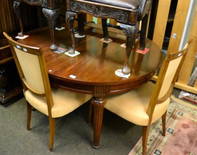 Lot 1596 - A reproduction extending dining table together with five dining chairs