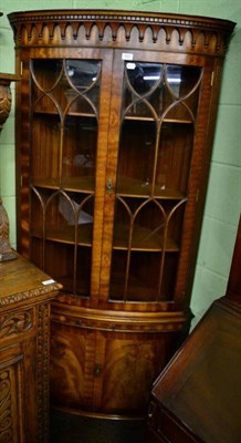 Lot 1607 - A reproduction mahogany Bevan Funnell corner cabinet