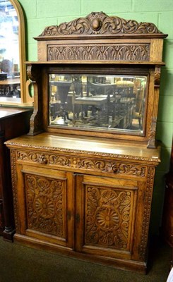 Lot 1608 - A late Victorian carved oak mirror back sideboard