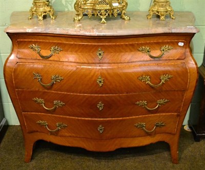 Lot 1622 - A French Louis XIV style bois satine and tulipwood banded Bombé shaped commode, late...