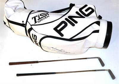 Lot 3008 - A Lee Westwood Signed Ping Leather Golf Bag, together with two putters, one with hickory shaft (3)