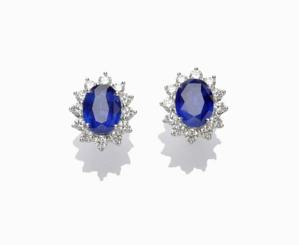 Lot 299 - A Pair of Sapphire and Diamond Cluster Stud Earrings, the oval mixed cut sapphires each sit...