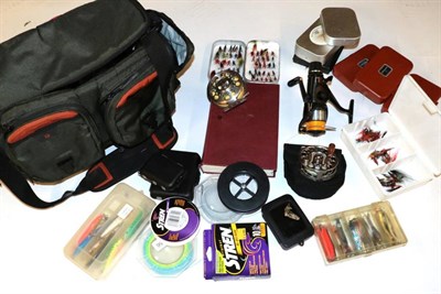 Lot 3056 - A Nylon Fishing Bag and Contents, including two Pflueger 'Trion' fly reels, Aero Baitrunner...