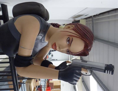 Lot 3099 - A Life Size Lara Croft Statue Tomb Raider film promo including two replica hand guns, 171cm...