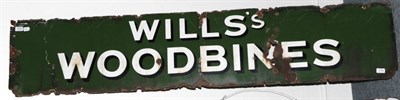 Lot 3154 - Wills Woodbines Enamel Sign white lettering on green ground 72x15'', 183x38cm (F-G, rust...