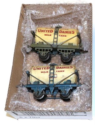 Lot 3228 - Hornby O Gauge Two United Dairies Tank Wagons one with blue 3rd type chassis, one with green...