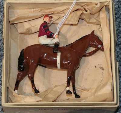 Lot 3376 - Britains Racing Colours Calumet Farm burgundy silks with black hoops on arms, red cap on bay (G box