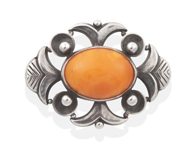 Lot 2007 - A Danish Amber Brooch, by Just Andersen, an oval amber in a rubbed over setting, within an abstract