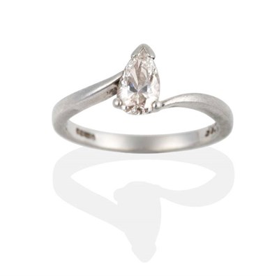 Lot 2011 - A Platinum Marquise Cut Solitaire Diamond Ring, to bypass scroll shoulders, estimated diamond...