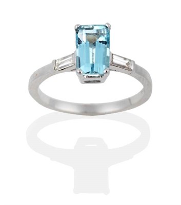 Lot 2025 - An 18 Carat White Gold Aquamarine and Diamond Ring, an octagonal cut aquamarine in a claw...