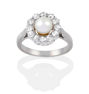 Lot 2033 - A Pearl and Diamond Cluster Ring, a pearl within a border of old cut diamonds, to tapering...
